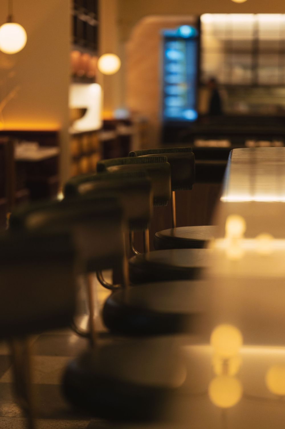 Blurred interior shots of a dimly lit modern space with bokeh lighting effects.