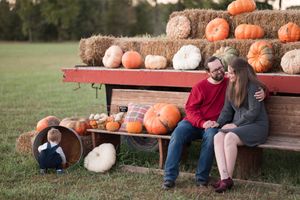 A collection of candid fall photos showing people sitting on wooden benches near pumpkin displays at a pumpkin patch.