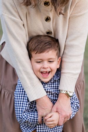 A series of playful moments captured in a blue gingham shirt and beige sweater showing joyful expressions and laughter.