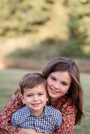 A sweet outdoor portrait series showing joyful embraces and genuine smiles against a soft natural background.