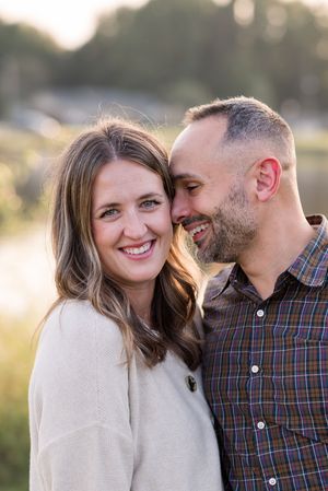 A romantic outdoor photo series showing a couple sharing tender moments and laughter in warm sunlight.