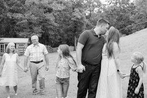 A series of black and white candid photos showing couples walking together in various outdoor settings.