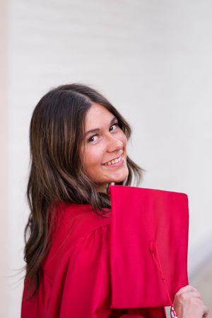 A person in a bright red blazer poses playfully in a sequence of photos against a light background.