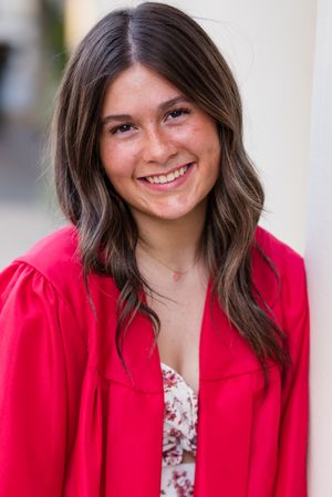 A series of headshots showing someone in a bright red blazer and floral top against a light blurred background.
