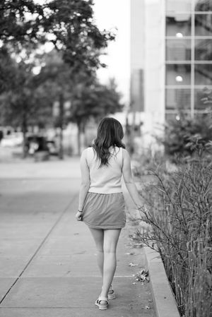 Black and white artistic photo series showing movement and dance poses on a concrete walkway.