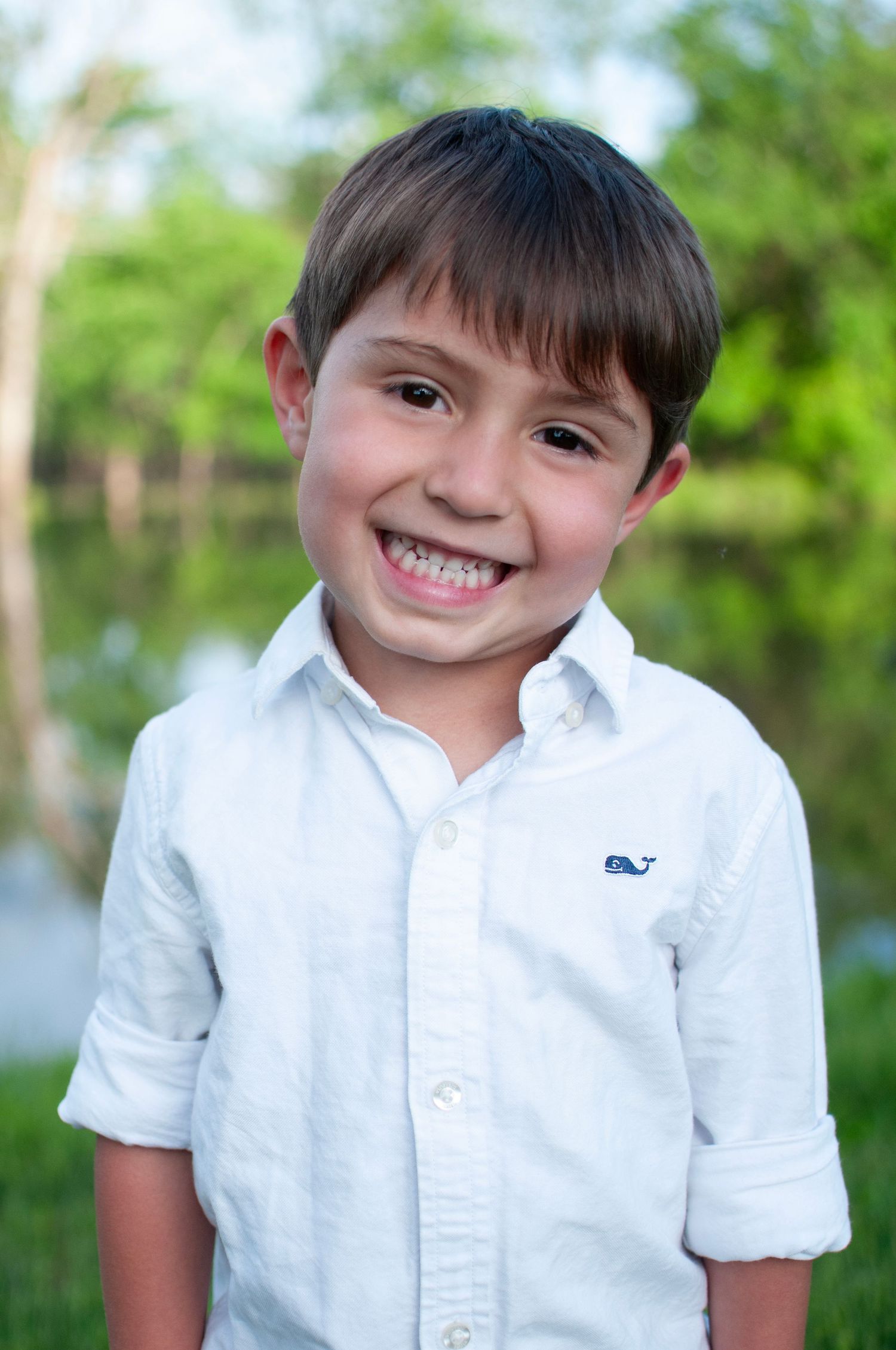 Solo image of toddler boy smiling outdoor photo