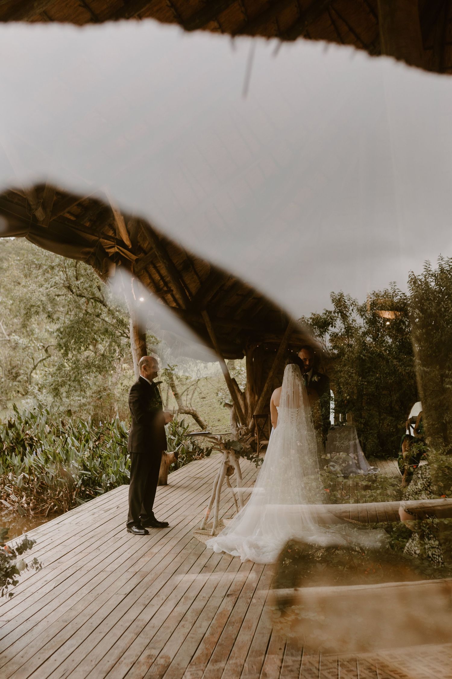 bride and groom getting married on a deck