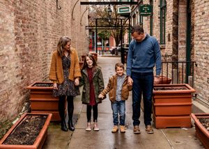 Downtown setting with rout iron arches makes a perfect setting for family photos.