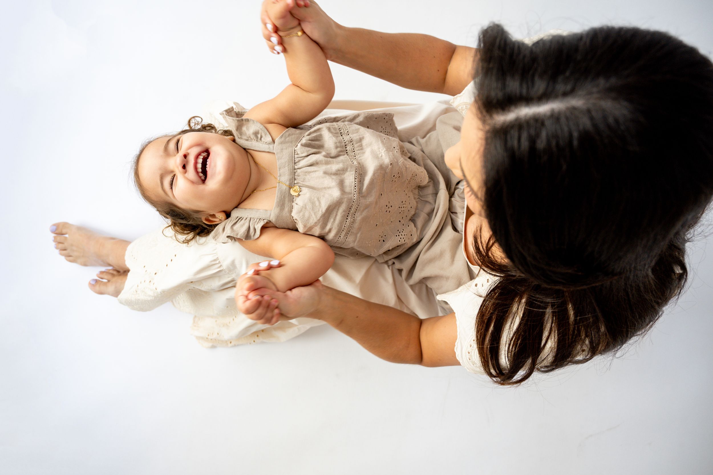 Artistic overhead photography sequence showing relaxed poses on white background.