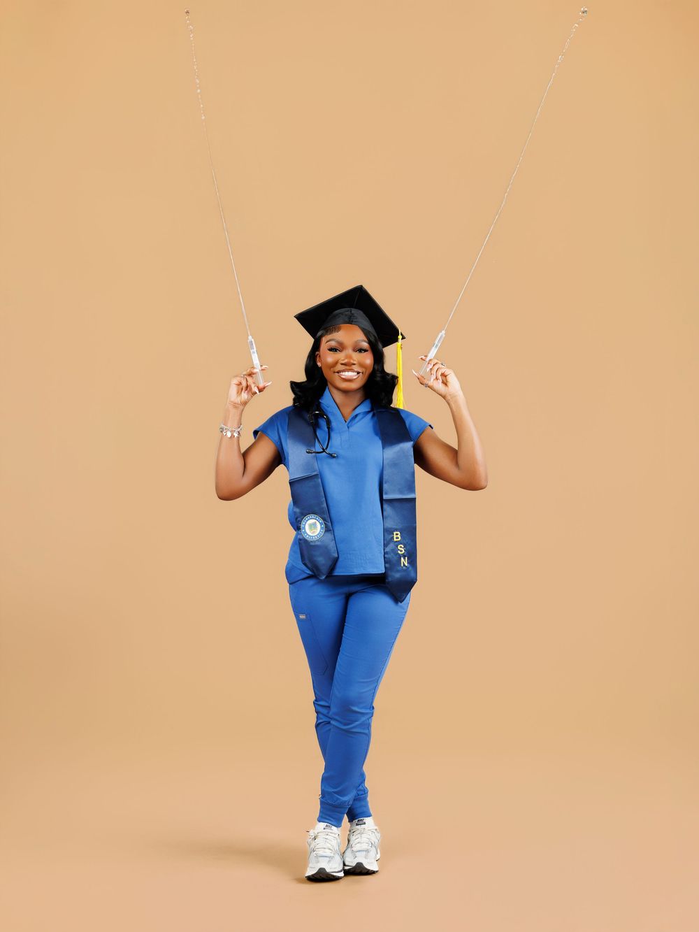 A person in blue medical scrubs poses in a sequence of dynamic movements against a beige background.