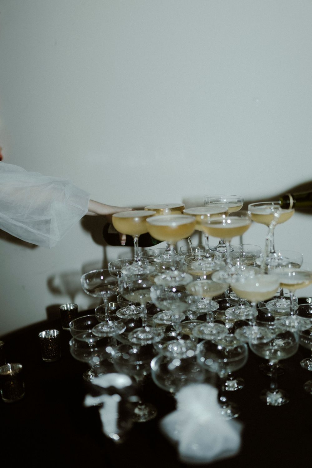Rows of champagne glasses arranged in an elegant display for a special event.