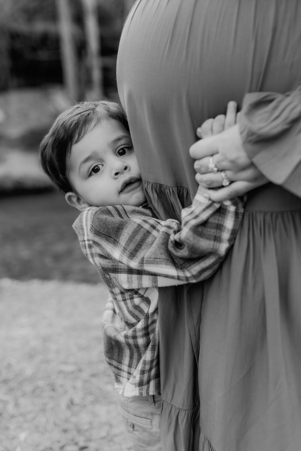 A North Alabama maternity photoshoot at Clarkson Covered Bridge in Cullman, AL. Beautiful maternity gown photos with family