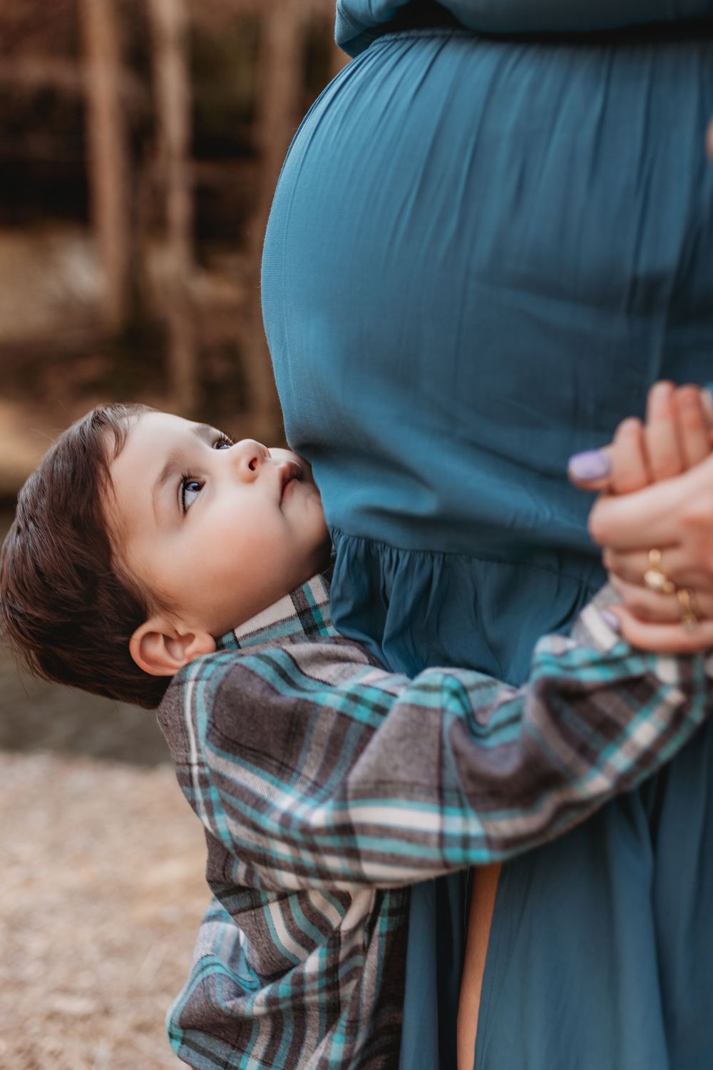 A North Alabama maternity photoshoot at Clarkson Covered Bridge in Cullman, AL. Beautiful maternity gown photos with family