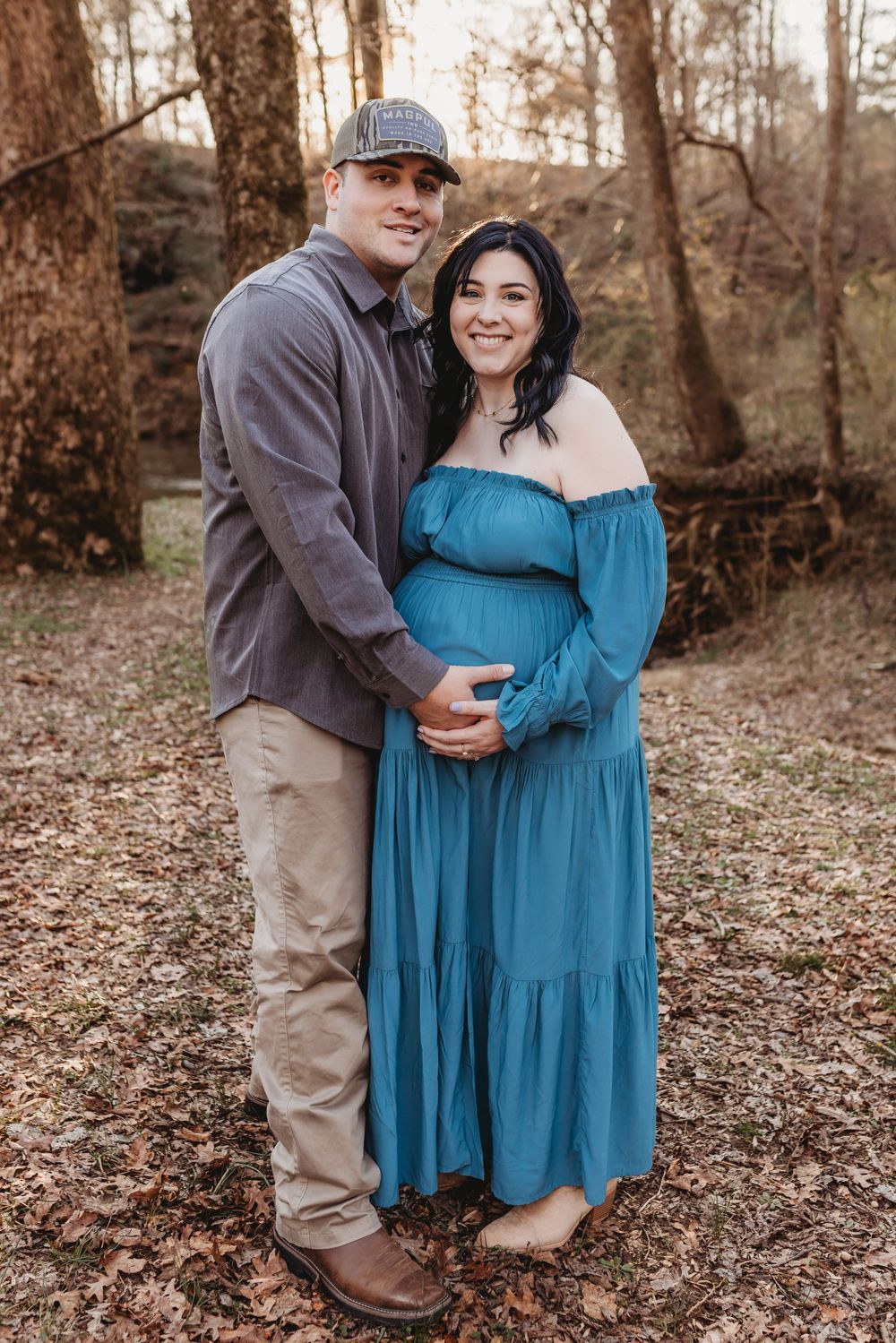 A North Alabama maternity photoshoot at Clarkson Covered Bridge in Cullman, AL. Beautiful maternity gown photos with family