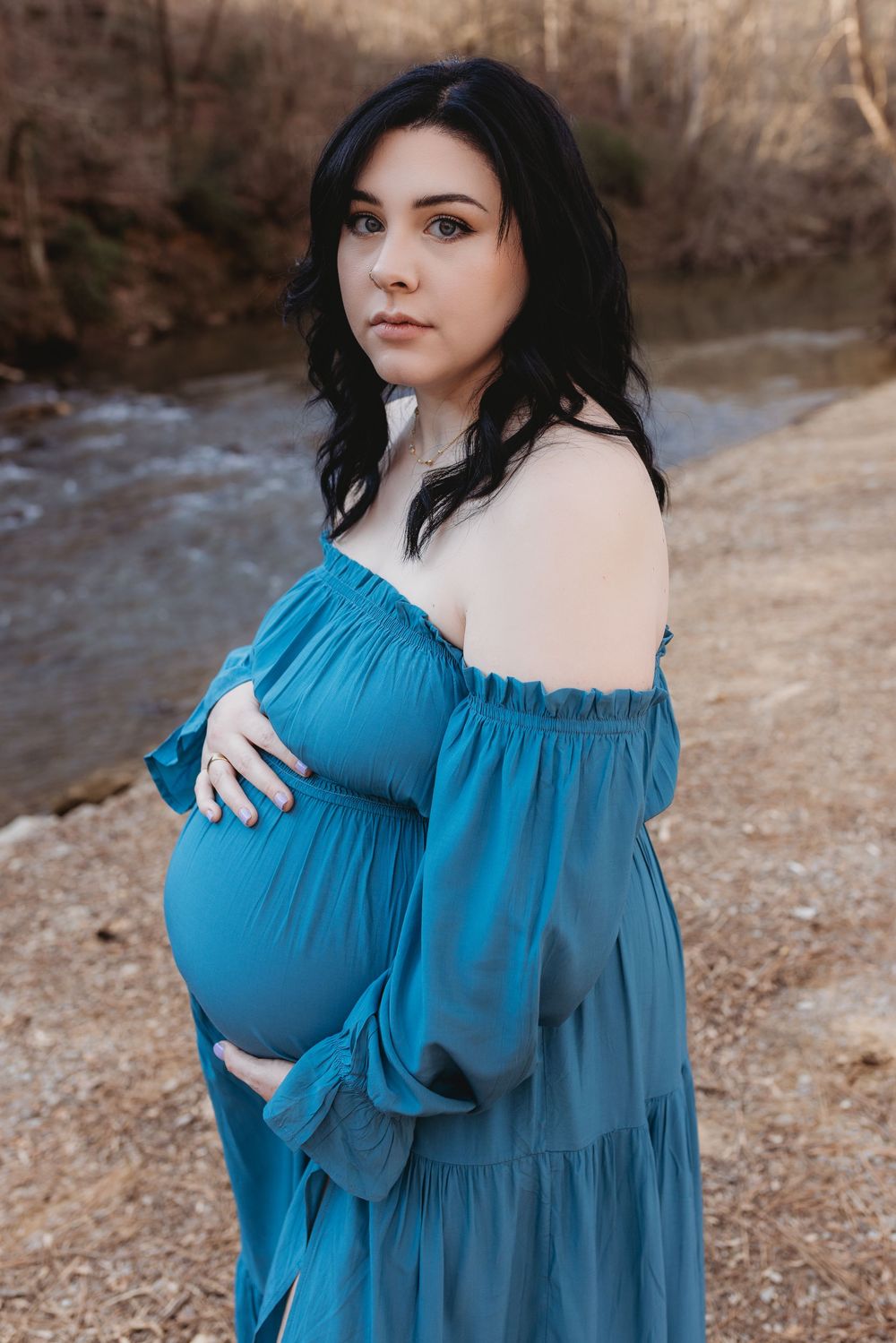 A North Alabama maternity photoshoot at Clarkson Covered Bridge in Cullman, AL. Beautiful maternity gown photos with family