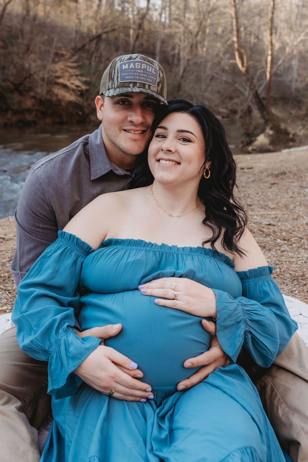 A North Alabama maternity photoshoot at Clarkson Covered Bridge in Cullman, AL. Beautiful maternity gown photos with family