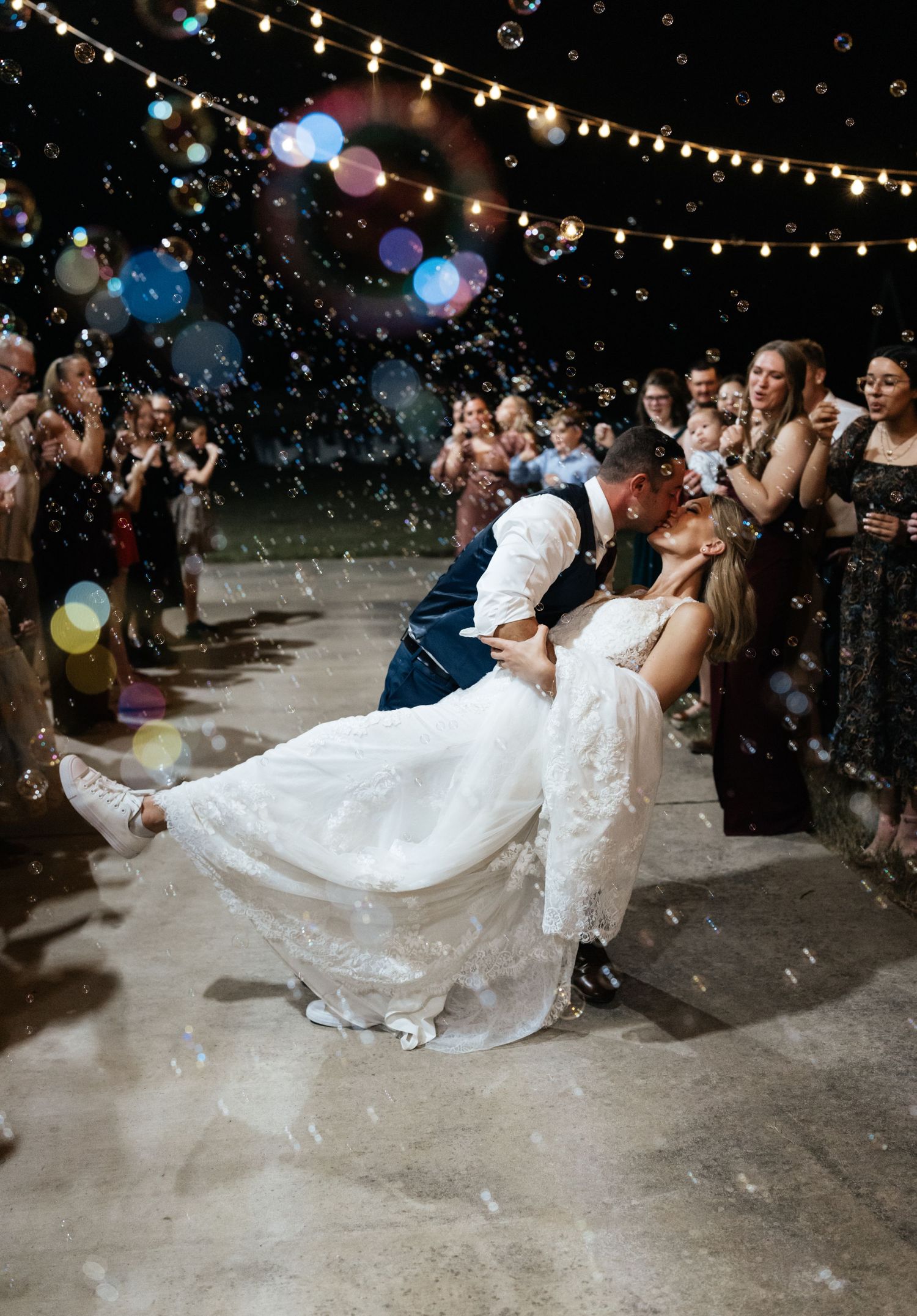 Bride and groom exiting their wedding during a festive send-off at Hidden Willows wedding venue in Cabot, Arkansas.