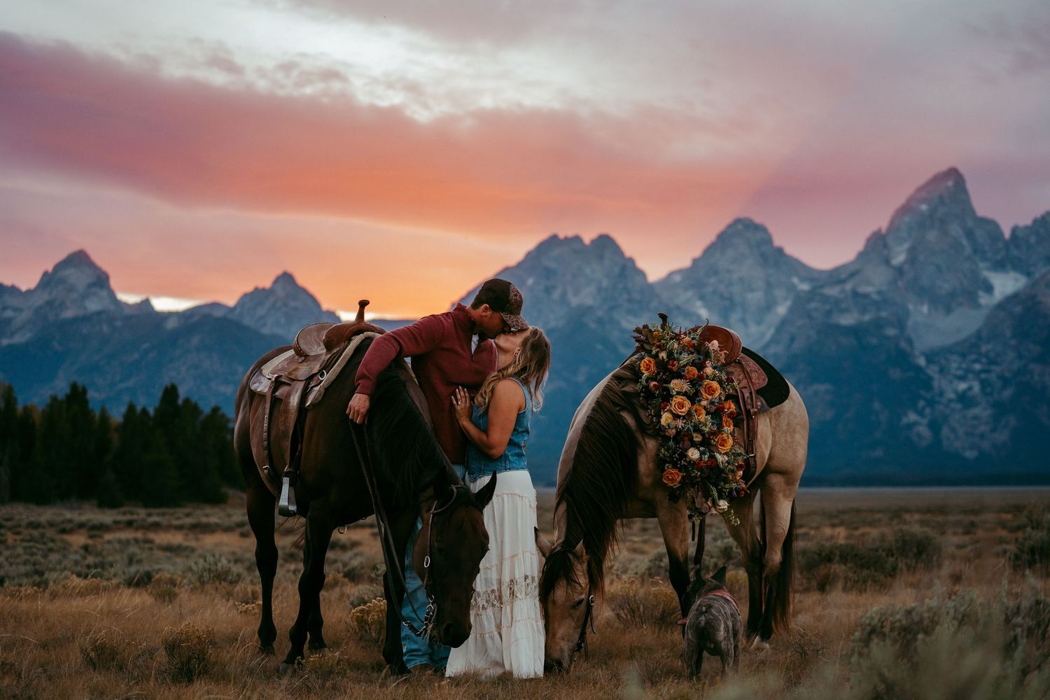 Bride and groom embracing in front of the Grand Tetons in Jackson Hole