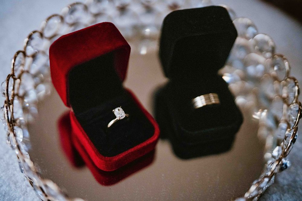 Wedding rings in red ring boxes on a silver tray - Sydney Nikah reception details