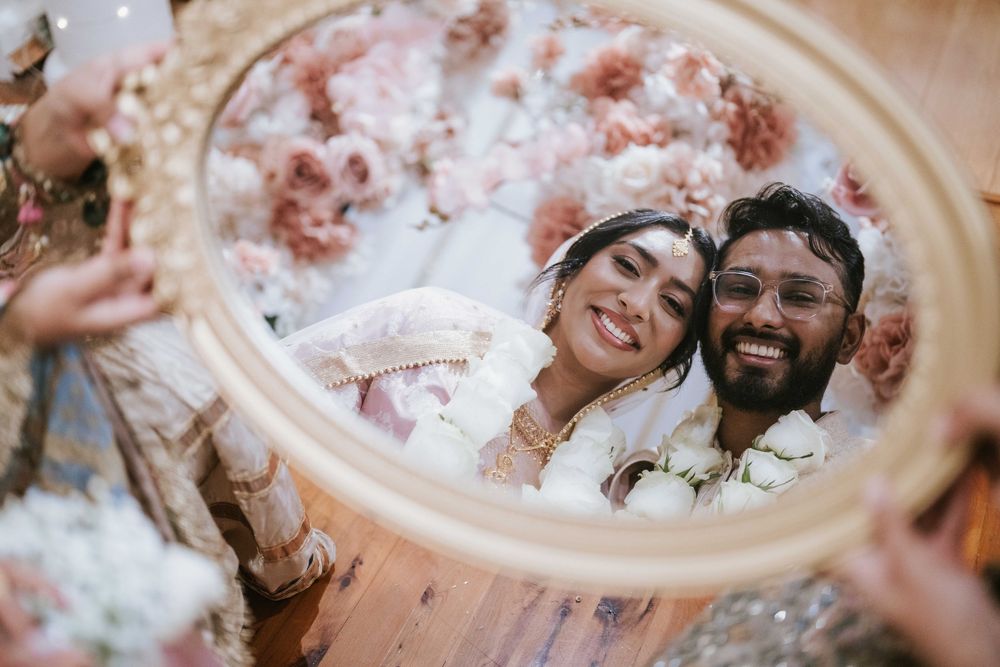 Bride and groom mirror ritual moment at their Sydney Nikah reception