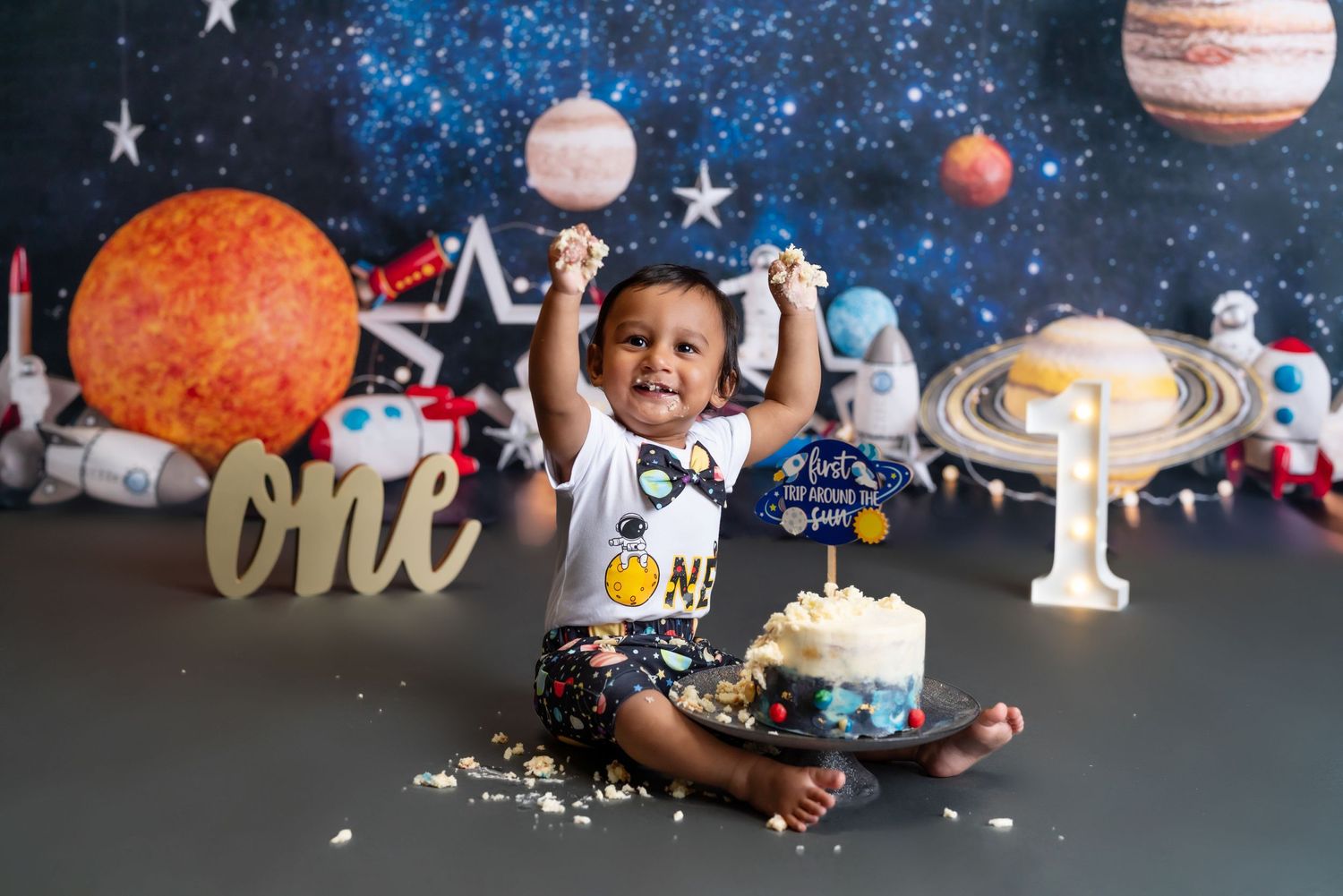 1st Trip around the sun. 1st birthday cake smash session in a Bothell, WA studio. birthday photography by Filling the Frame Photography