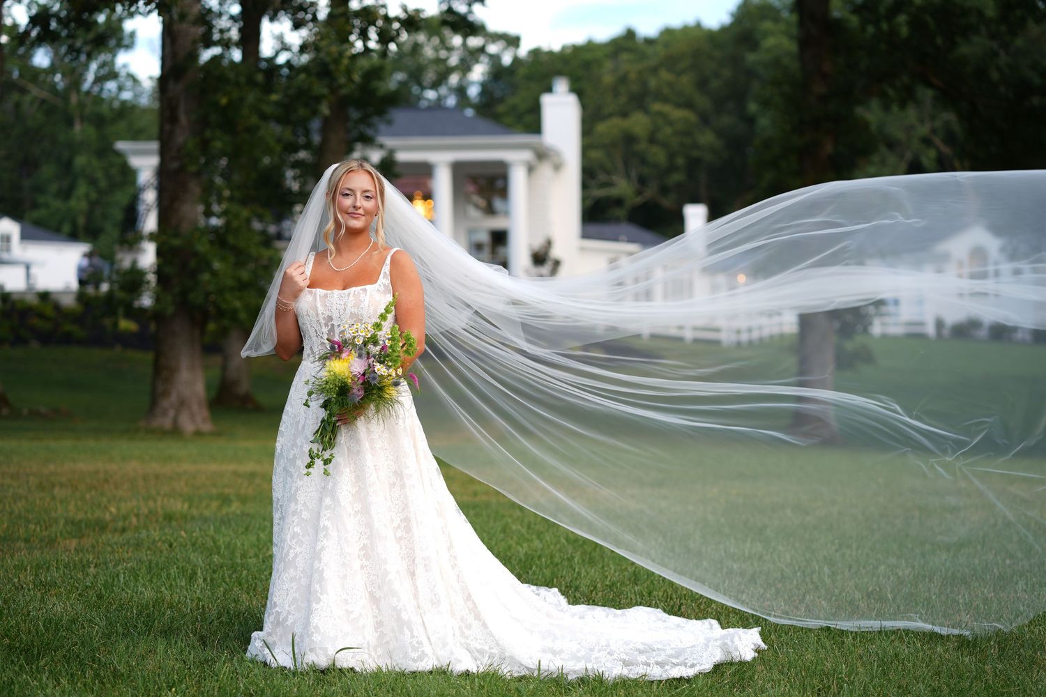 luxury bridal portrait with veil flowing out behind her in Mebane, NC