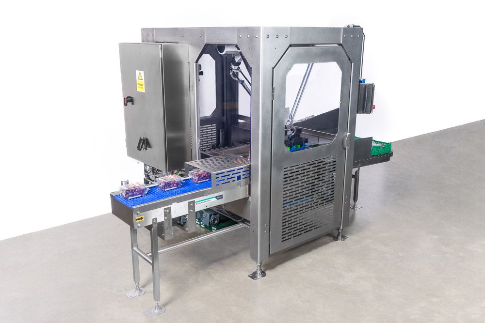 Stainless steel industrial automated capping machine with conveyor belt system for food or beverage production lines.