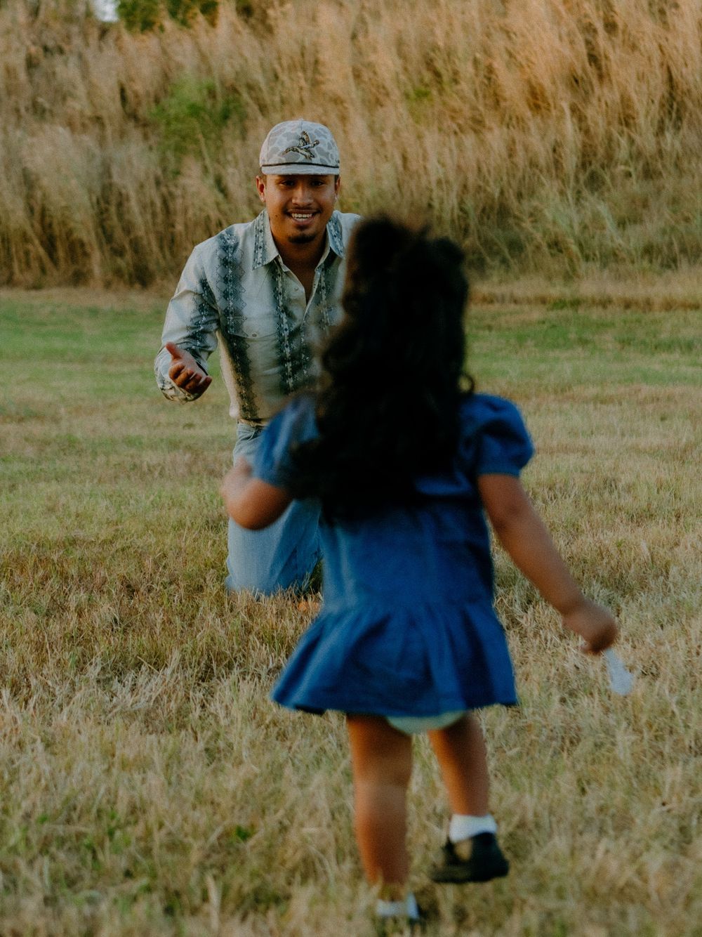 Daughter running to father at barkley meadows park