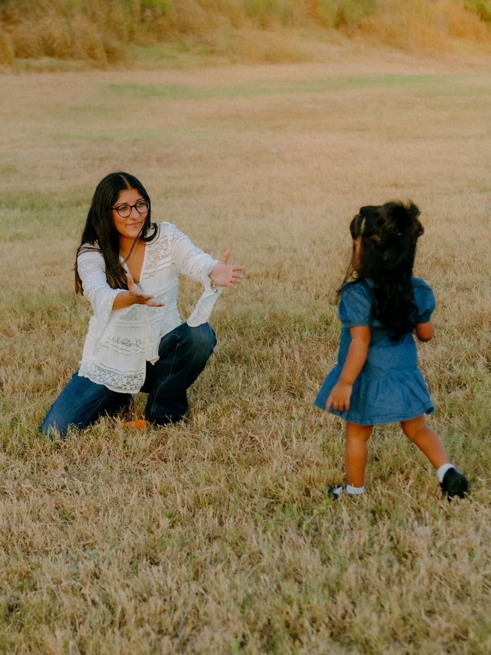 Daughter running to mother at barkley meadows park