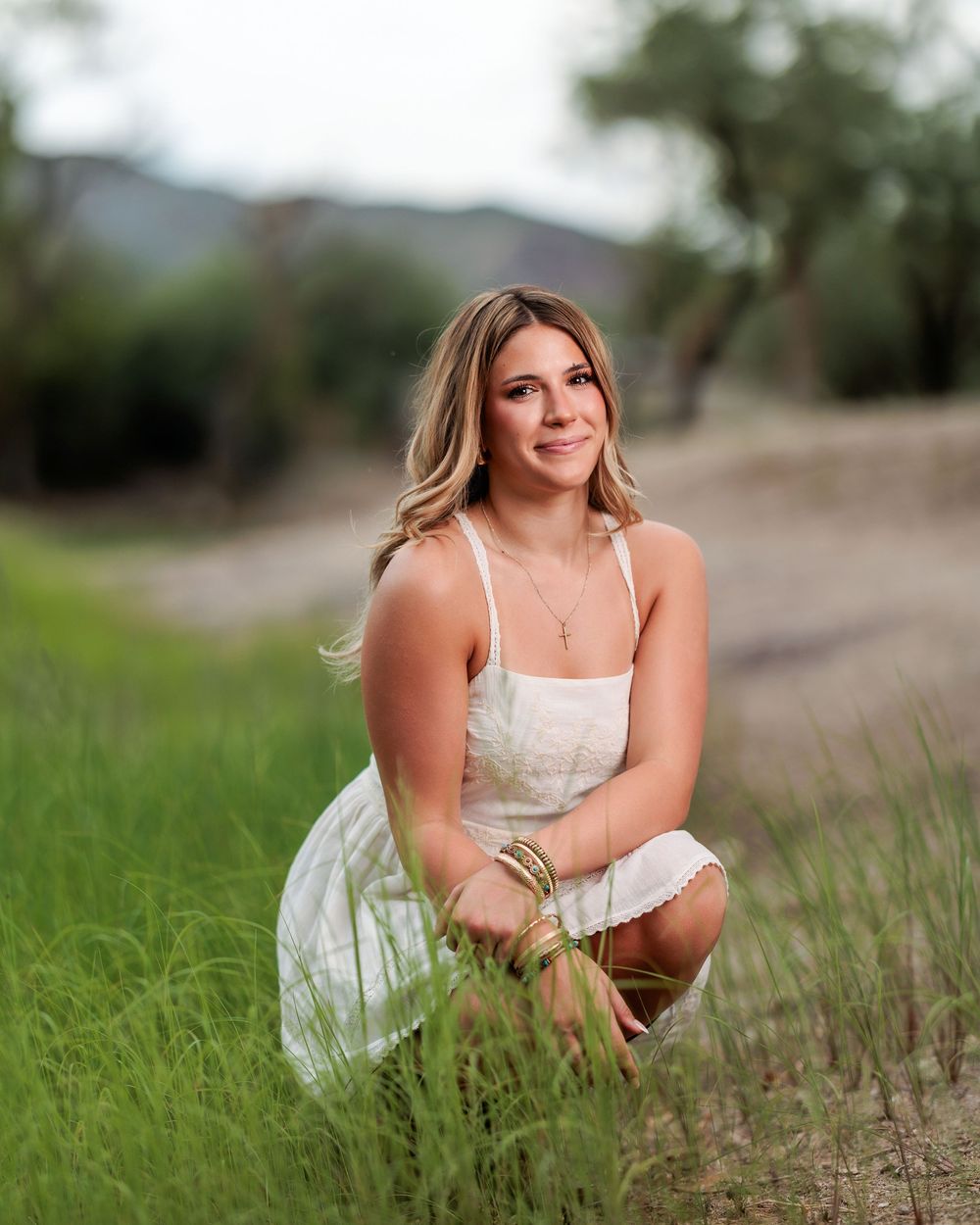Western Tucson Senior pictures session in the Desert with stormy sky