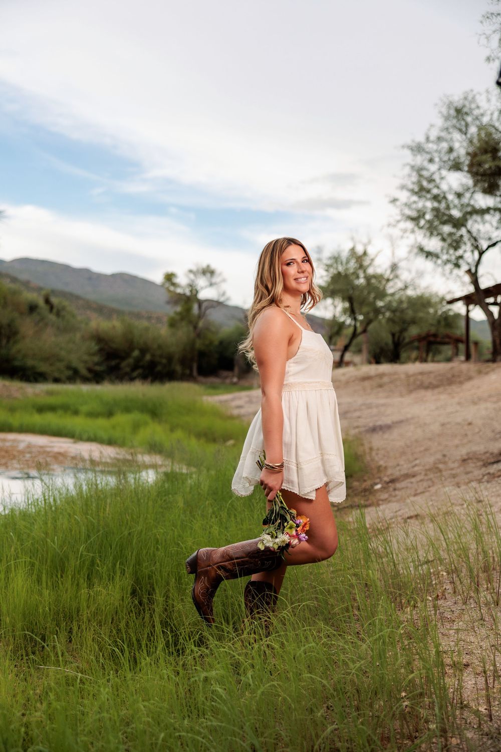 Western Tucson Senior pictures session in the Desert with stormy sky