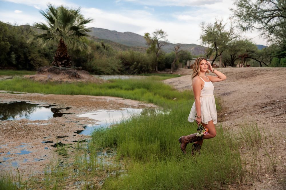 Western Tucson Senior pictures session in the Desert with stormy sky at Tanque Verde Guest Ranch