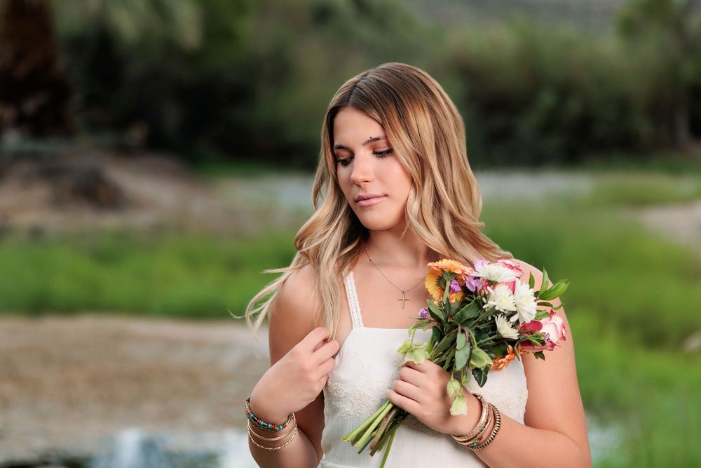 Western Tucson Senior pictures session in the Desert with stormy sky at Tanque Verde Guest Ranch