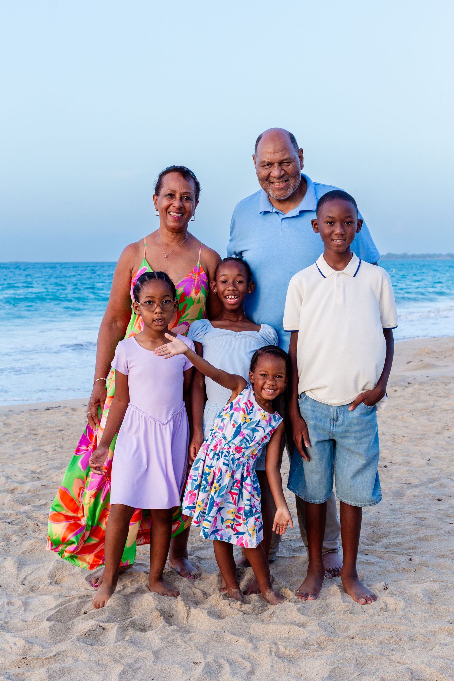 Family portrait. Grandparents and four grandkids on the beach in Isla Verde, Carolina, Puerto Rico.