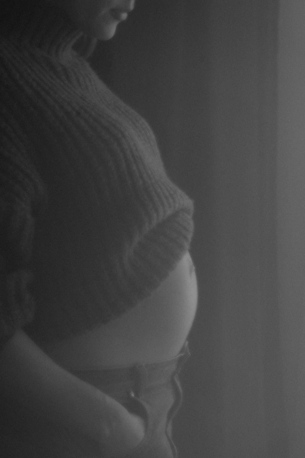 pregnant lady in black and white side profile in studio