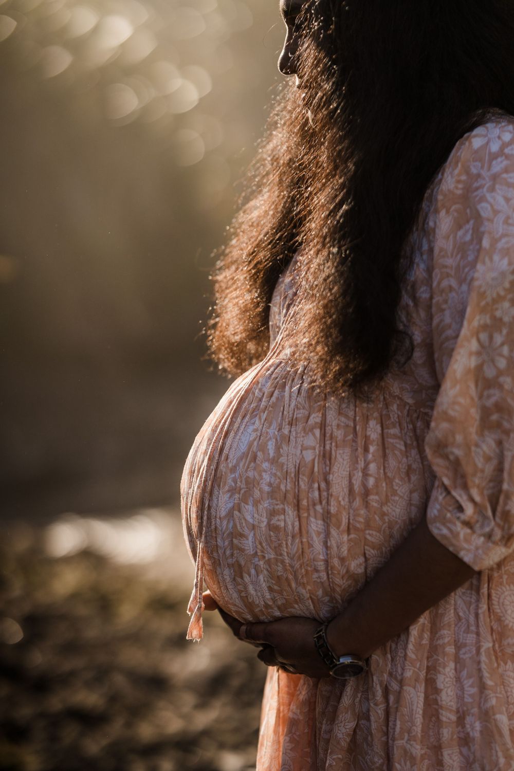 Side profile of pregnant lady at 12mile beach on the west coast north of Greymouth