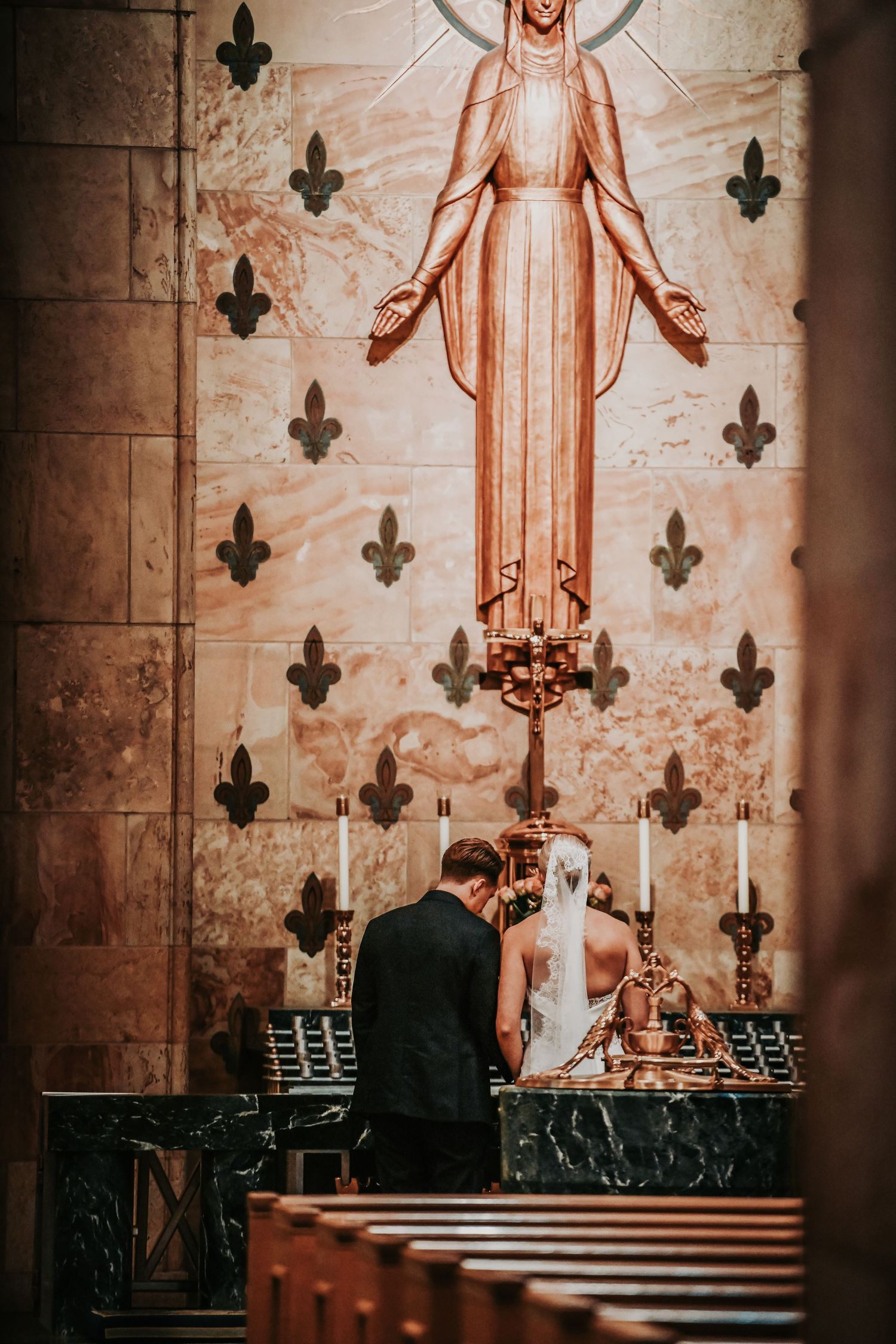 Sacred wedding moment inside Christ the King Catholic Church