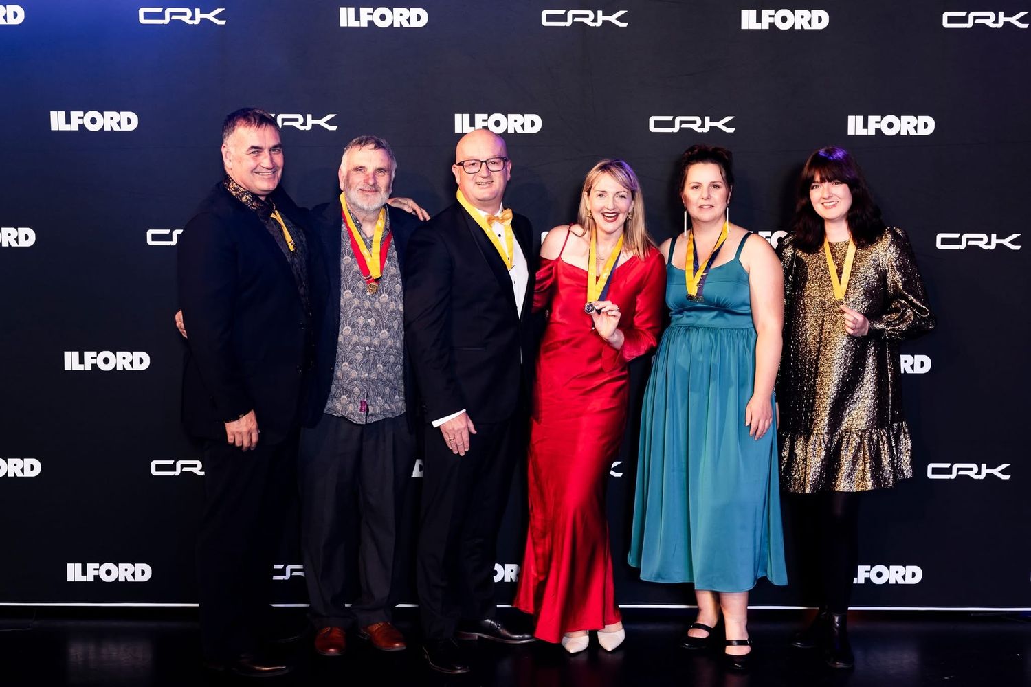 group photo with stewart at NZIPP Gala awards night after receiving his maters of photography with distinction