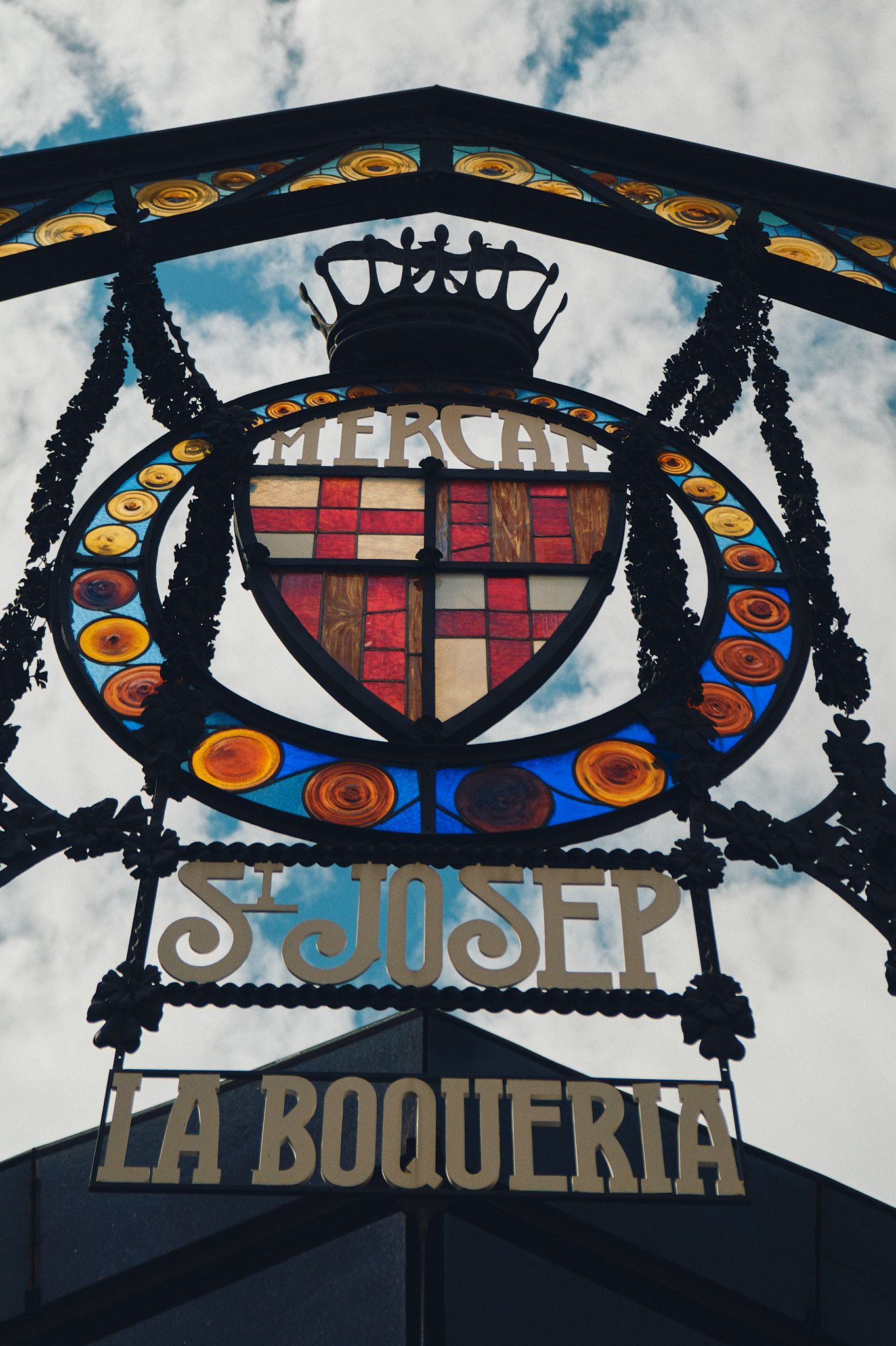 Ornate stained glass sign for Mercat de Sant Josep de la Boqueria market in Barcelona, Spain.
