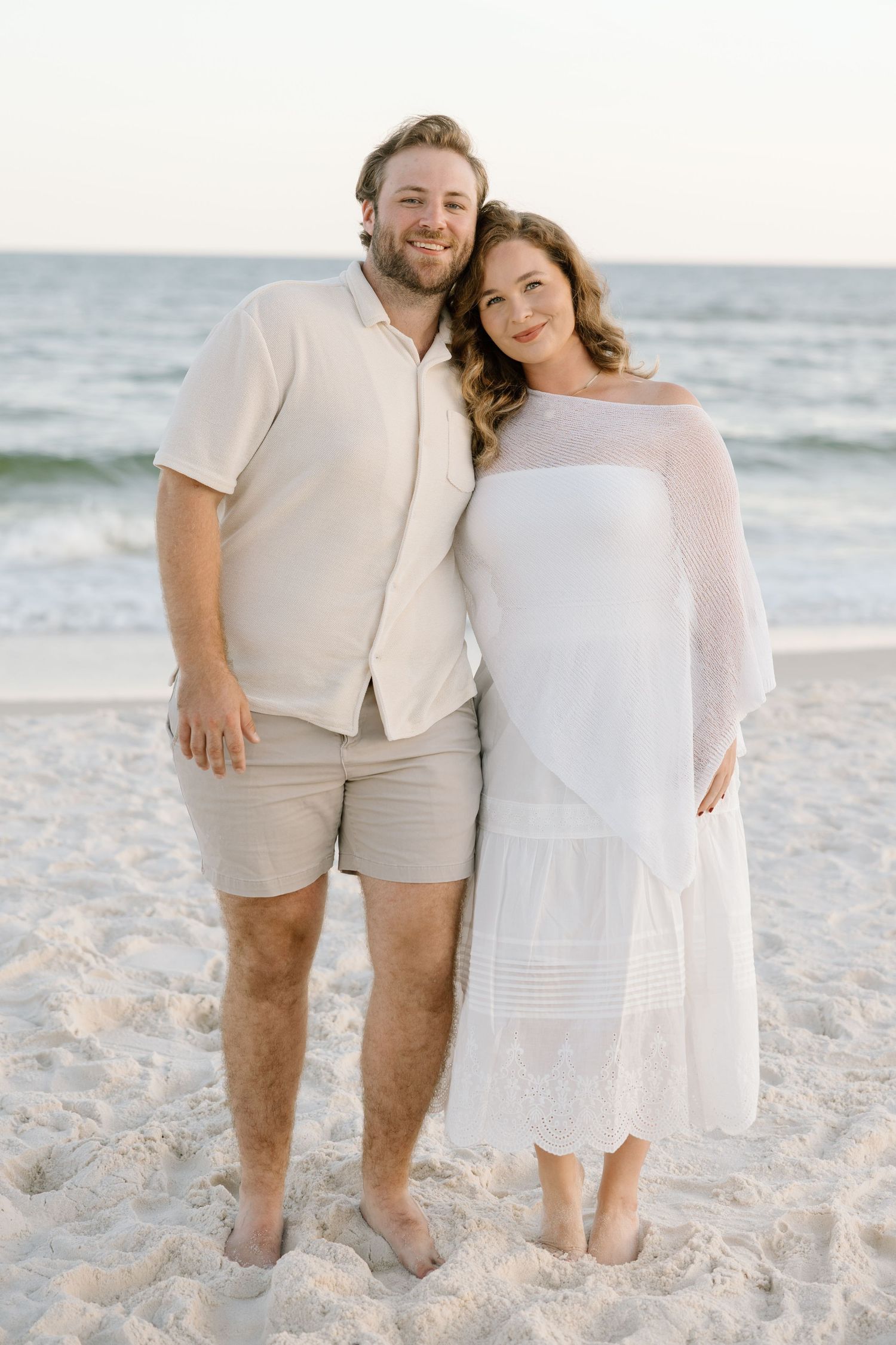 Couple shoot smiling on the beach in Gulf Shores and Orange Beach Alabama.