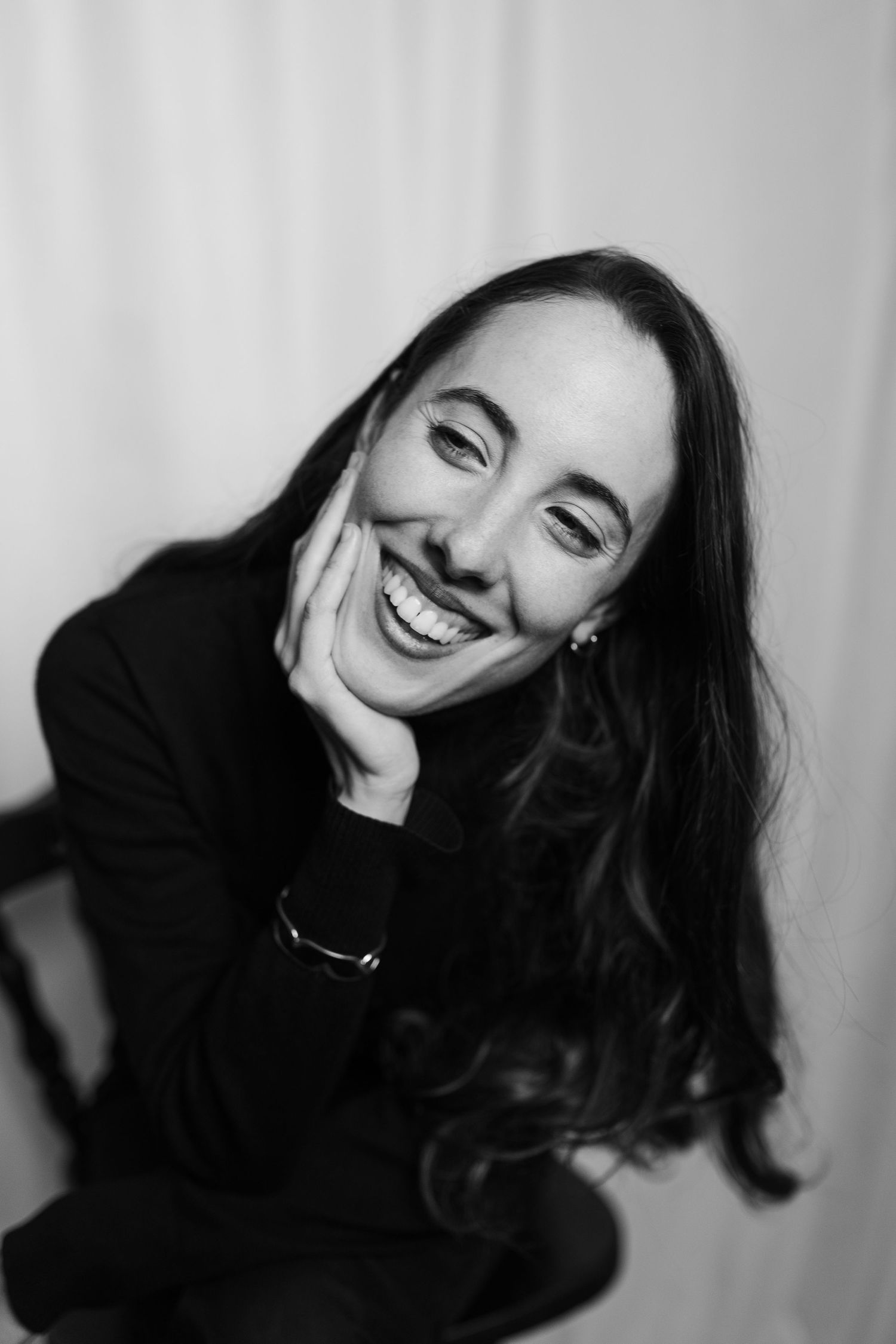 Black and white portrait series showing expressions of joy and laughter.