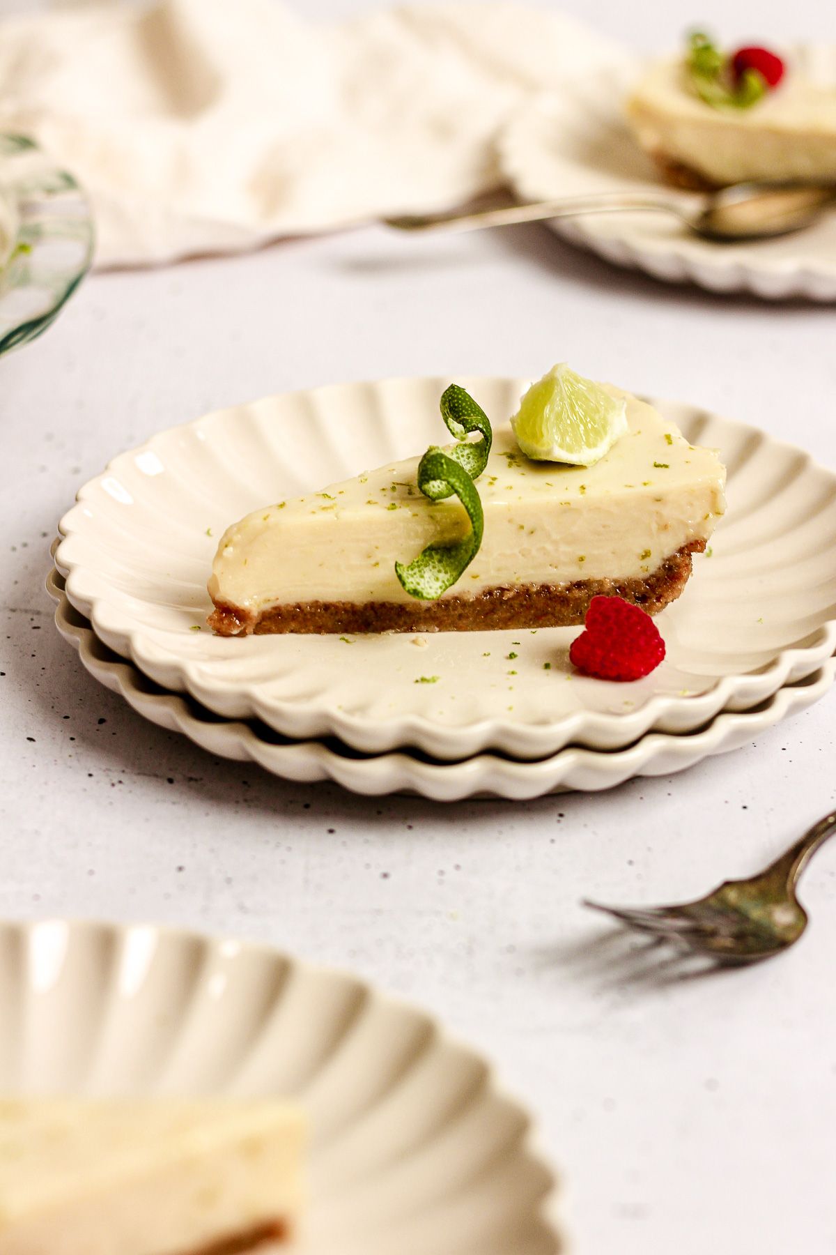 key lime pie slice with lime wedge