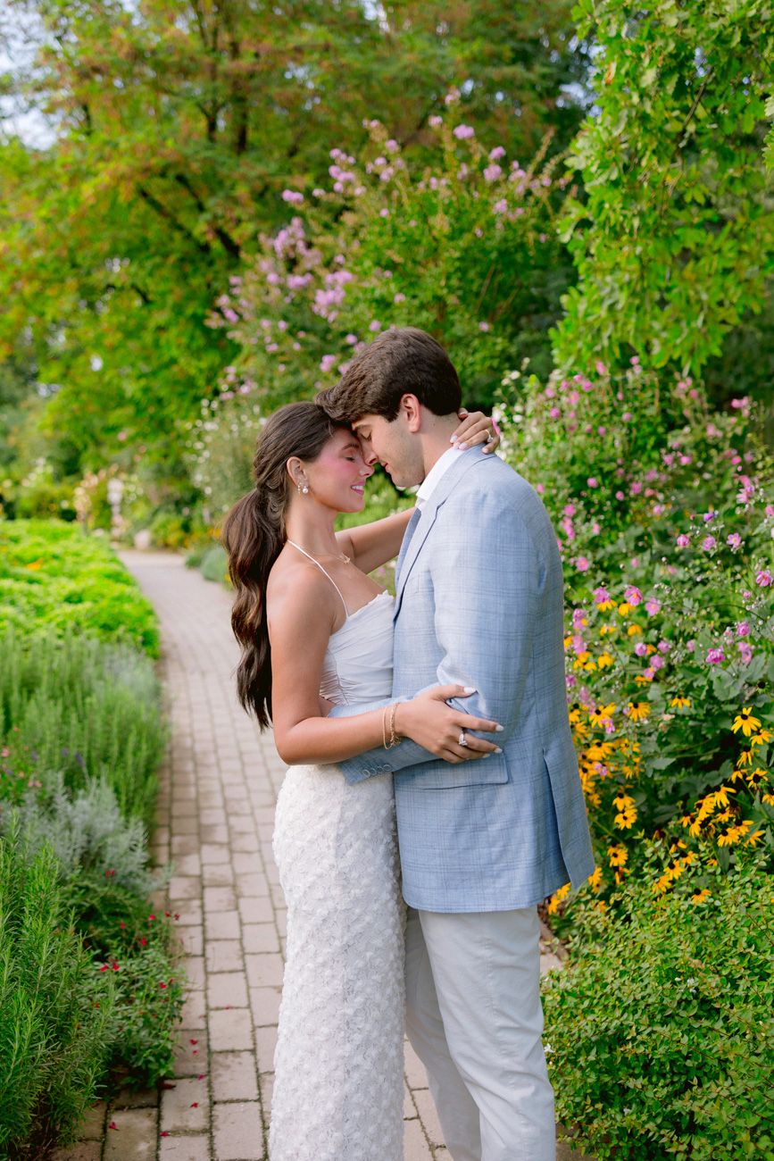 Bride and groom portrait in a lush garden during their rehearsal dinner at a Lake Garda wine resort