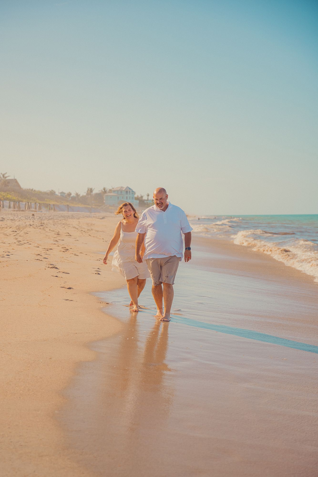A couple walks the beach at Disney's Vero Beach Resort