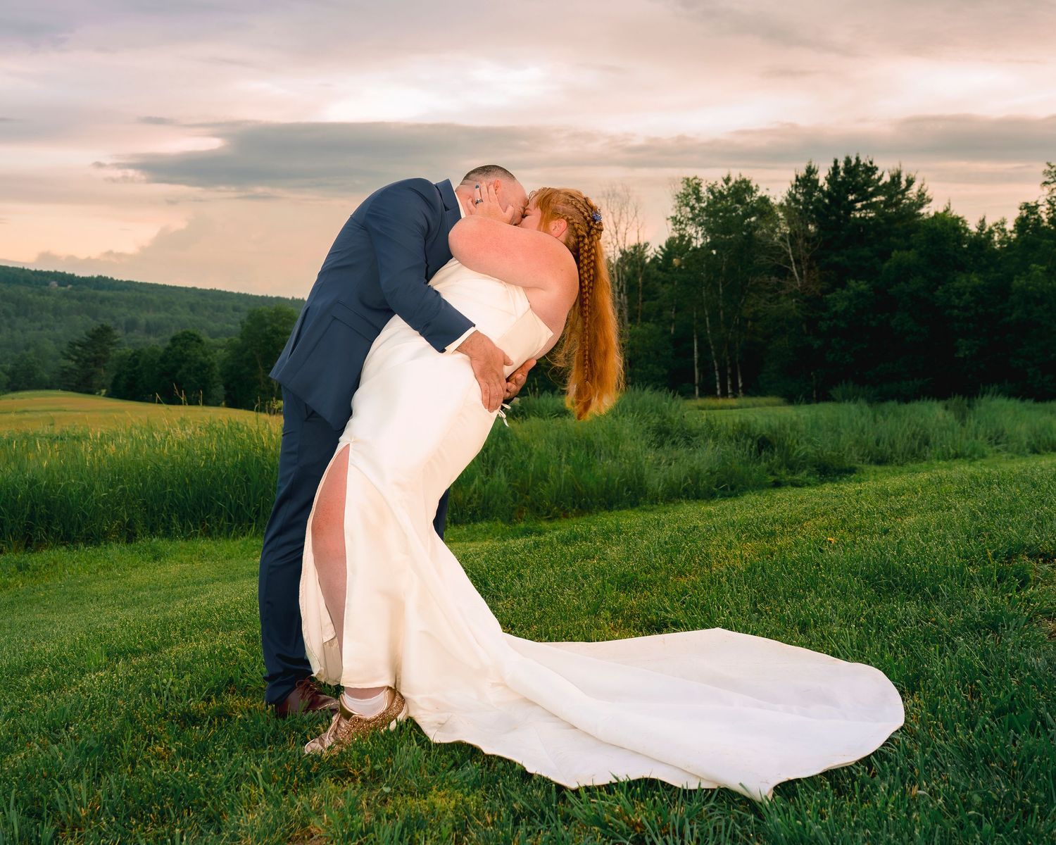 Bride and groom in sunset light at a New England barn wedding