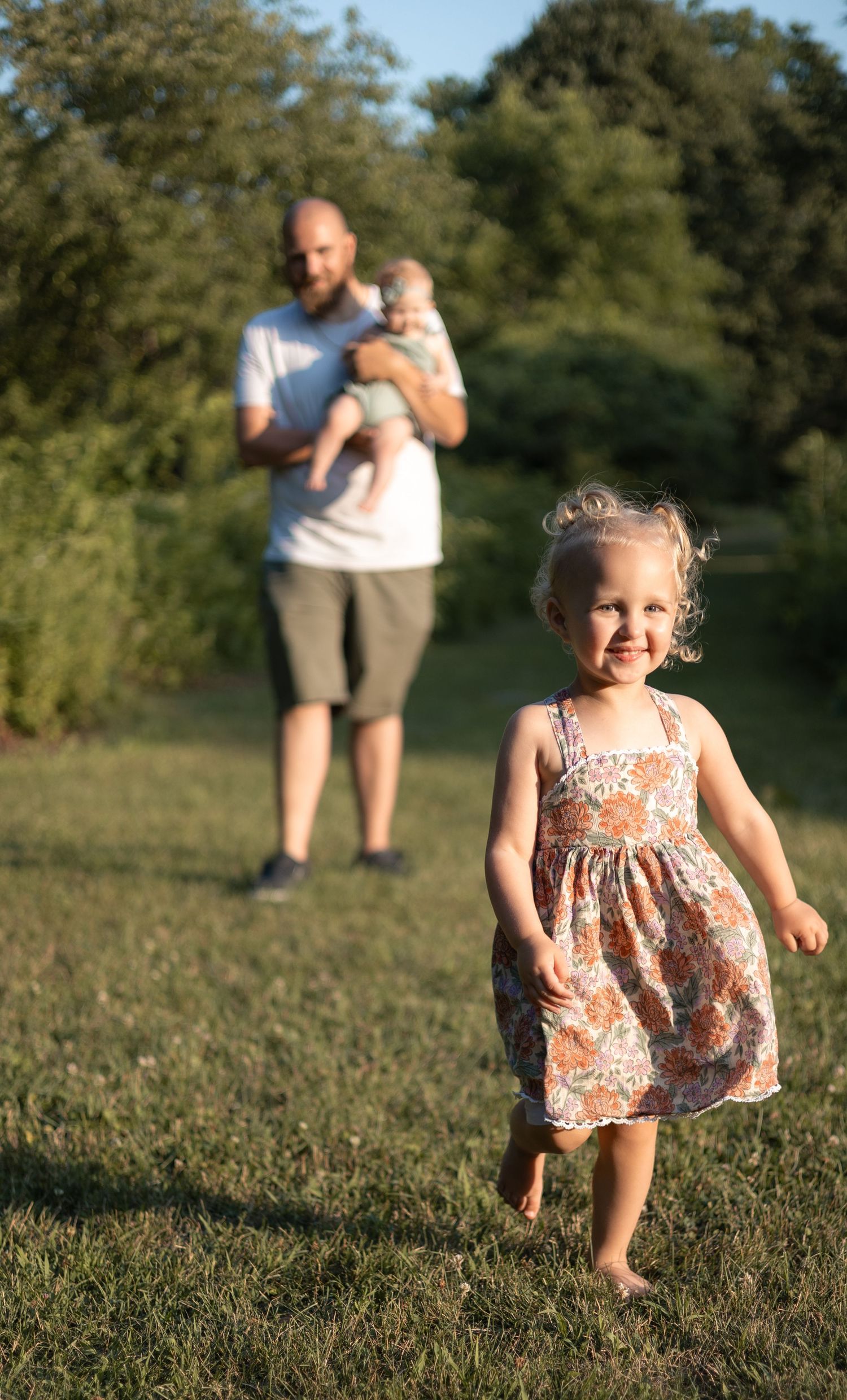 Father playing with his daughters during an outdoor session in Acton, MA