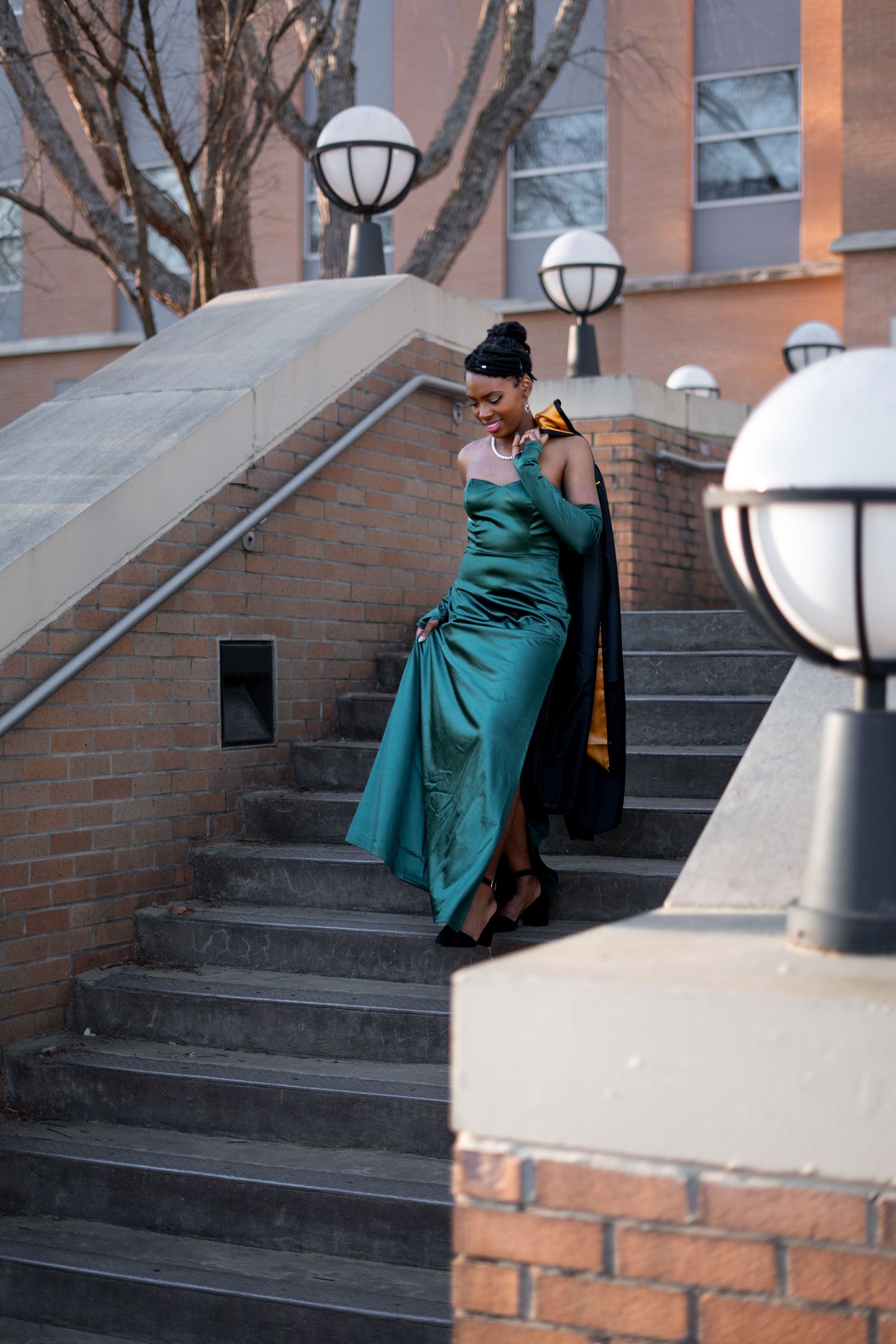 KSU graduation photos at the Kennesaw state sign on the Kennesaw college campus