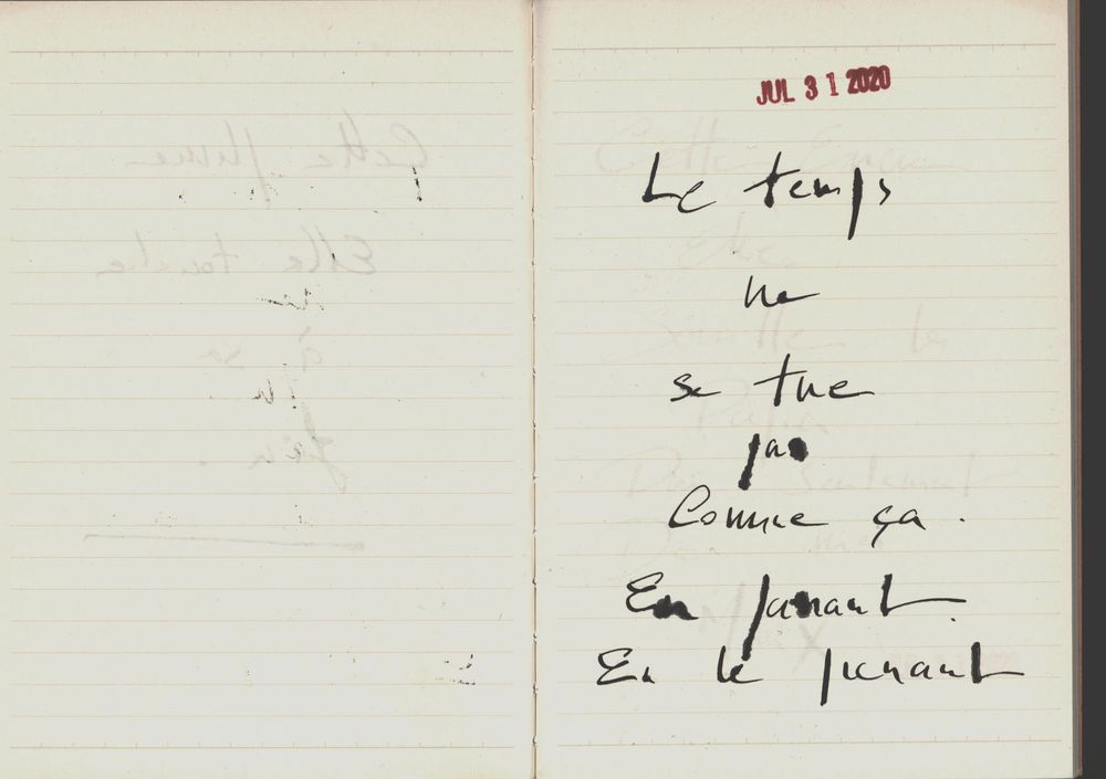 Open notebook with handwritten French text reading poetic phrases in black ink on white lined pages.