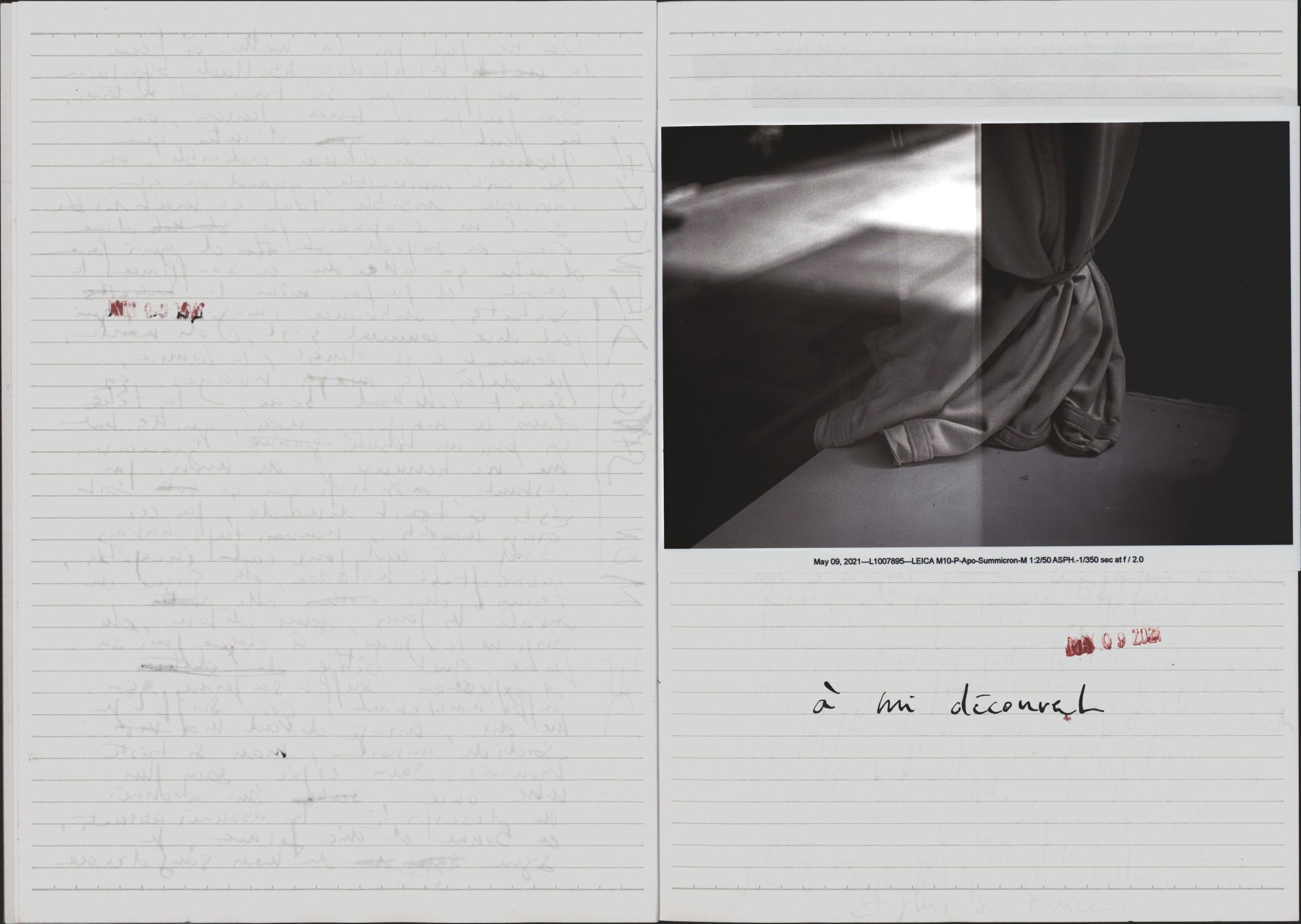 Open book showing handwritten text on left page and black-and-white photo of draped fabric on right page.