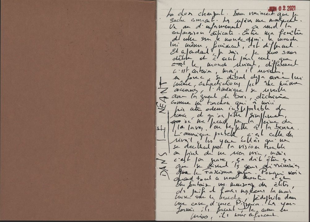 Handwritten letter in French script on aged paper, alongside a dark brown envelope or folder.
